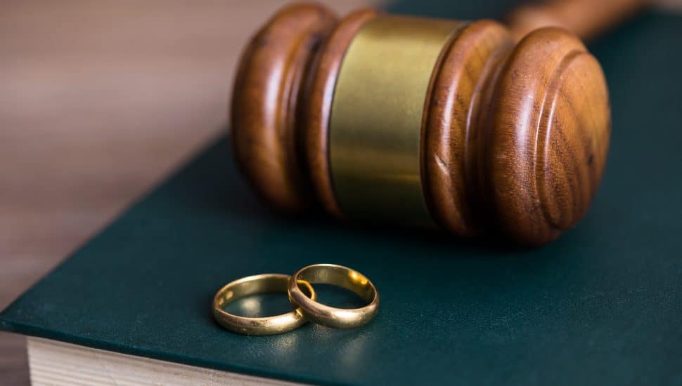 rings with judge on book on table