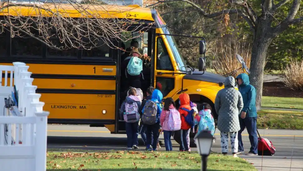 kids getting on a bus