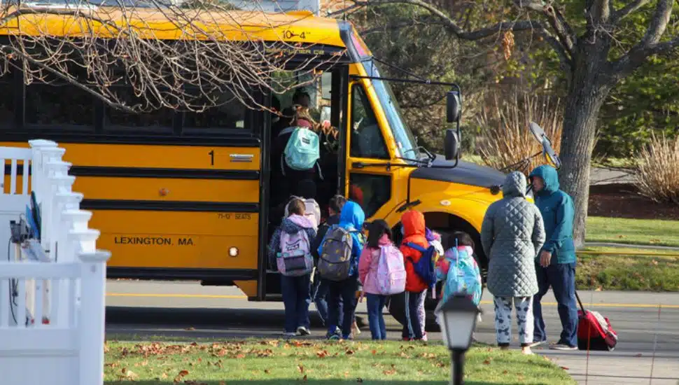 kids getting on a bus