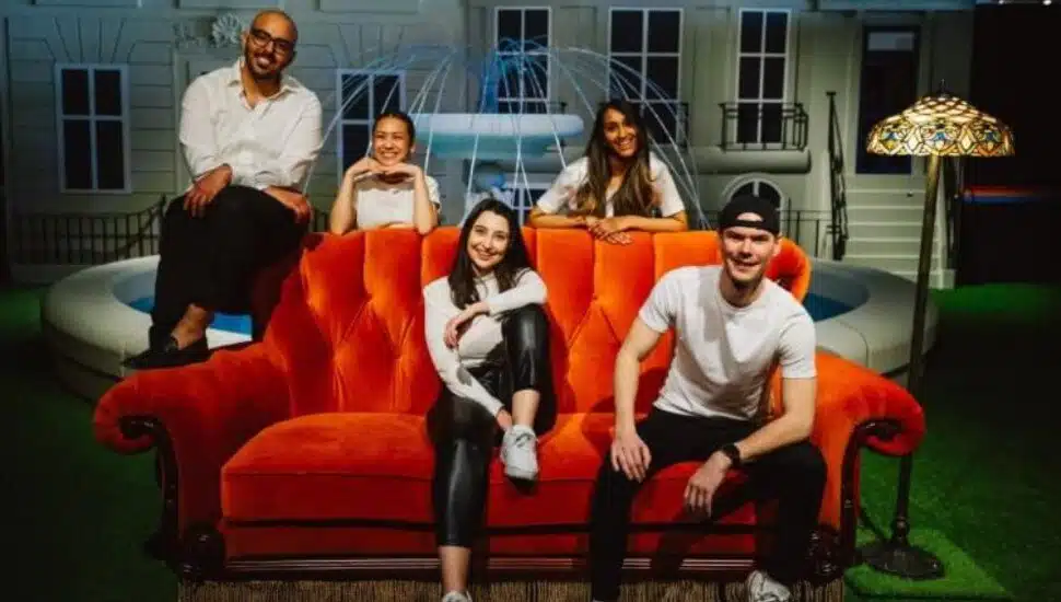 people on red couch