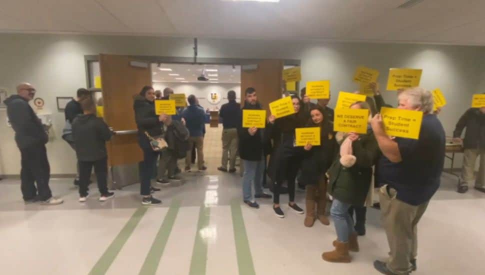 people with yellow signs