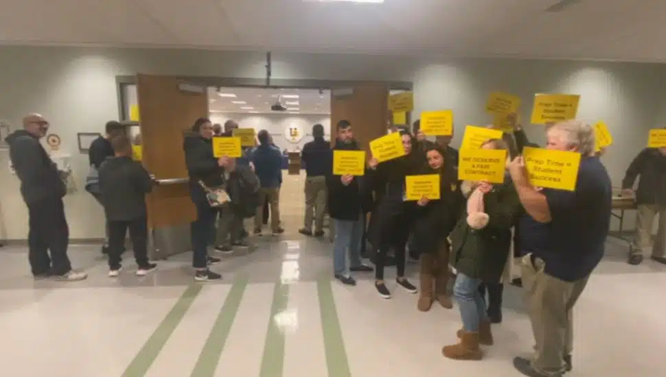people with yellow signs