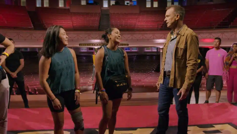 three people on a stage