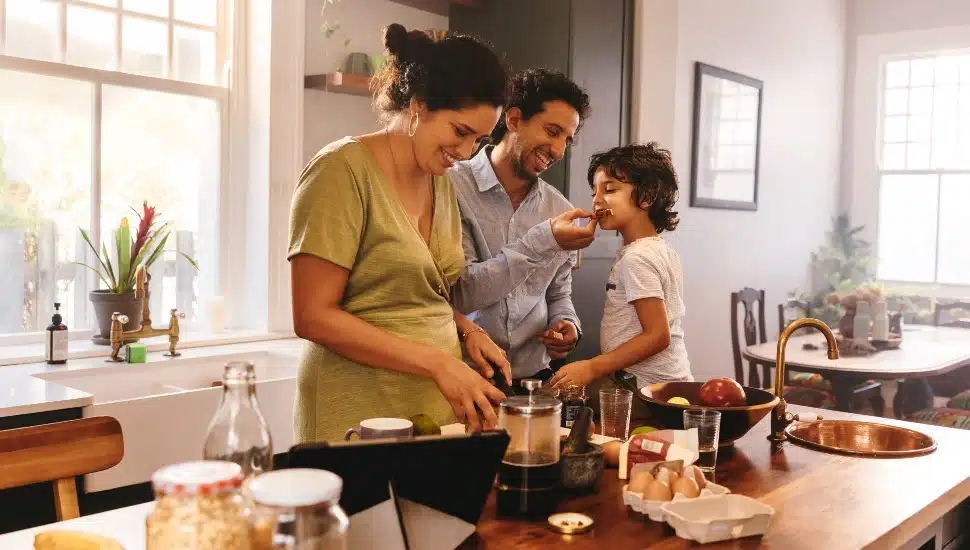 A young family fixing breakfast