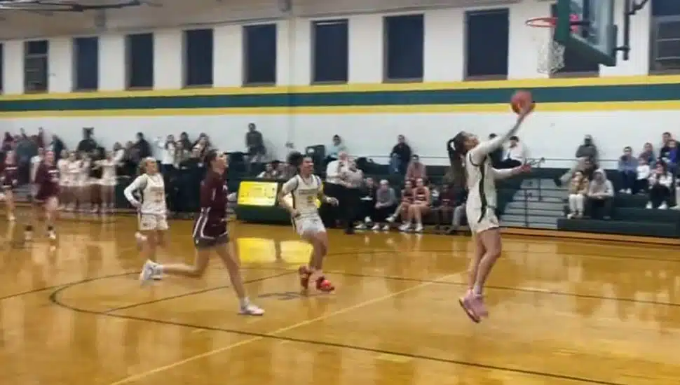 Gabby Casey scoring a basket