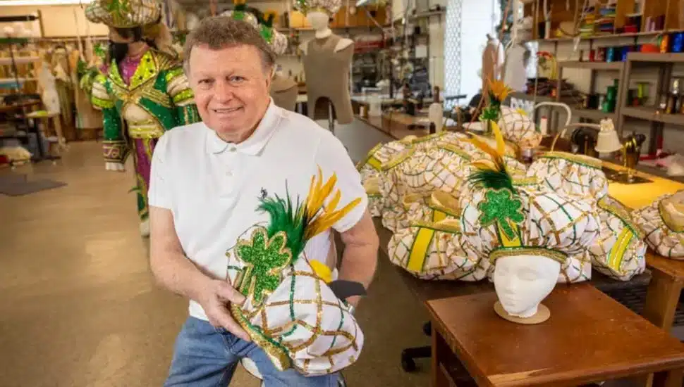James May holding Jason Kelce “fan hats.”