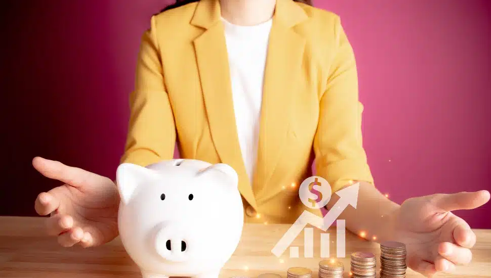 businesswoman piggy bank coins, upward arrow graph, lots of money