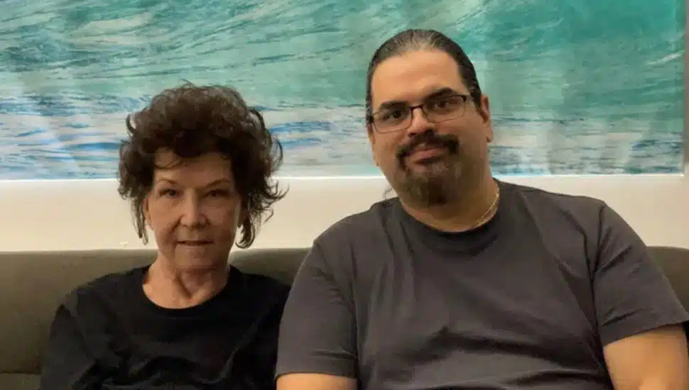 two friends seated side-by-side Chris Wiley and Phyllis Procopio