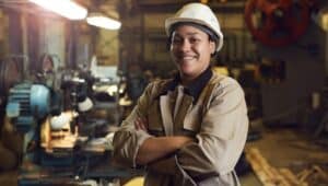 woman in hard hat benefiting from technical education
