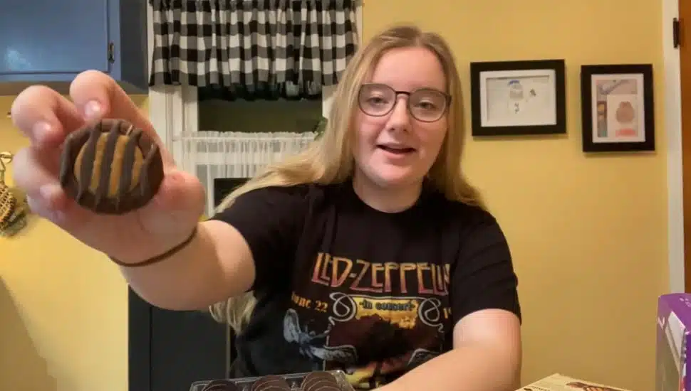 Food Critic Maggie Robionson holding a cookie