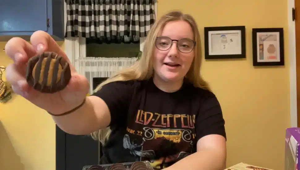Food Critic Maggie Robionson holding a cookie