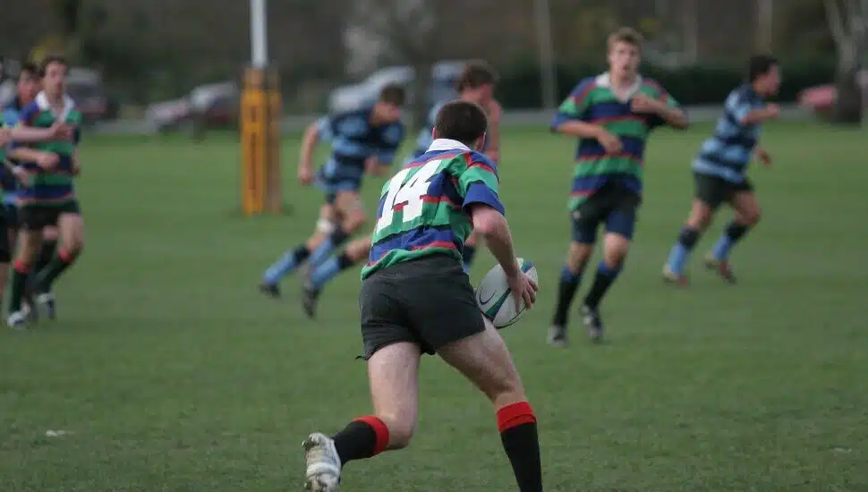 Guys playing Rugby