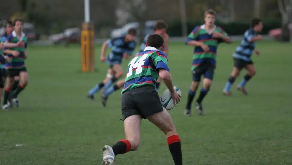 Guys playing Rugby