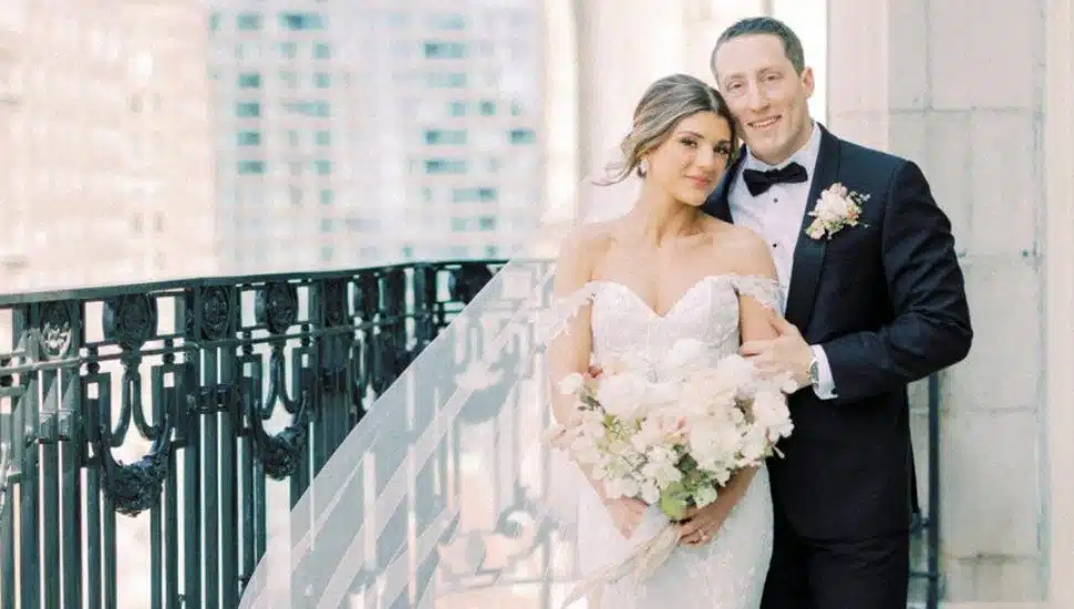 SJU couple on a balcony