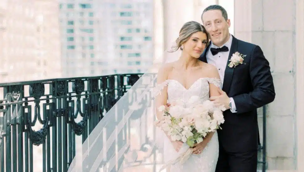 SJU couple on a balcony