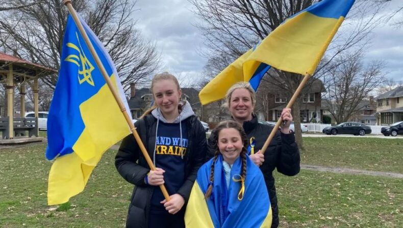 Dora Powzaniuk and daughters, Oriana, and Lara of Schwenksville, rally on March 20 at Reeves Park, Phoenixville, for peace in Ukraine.