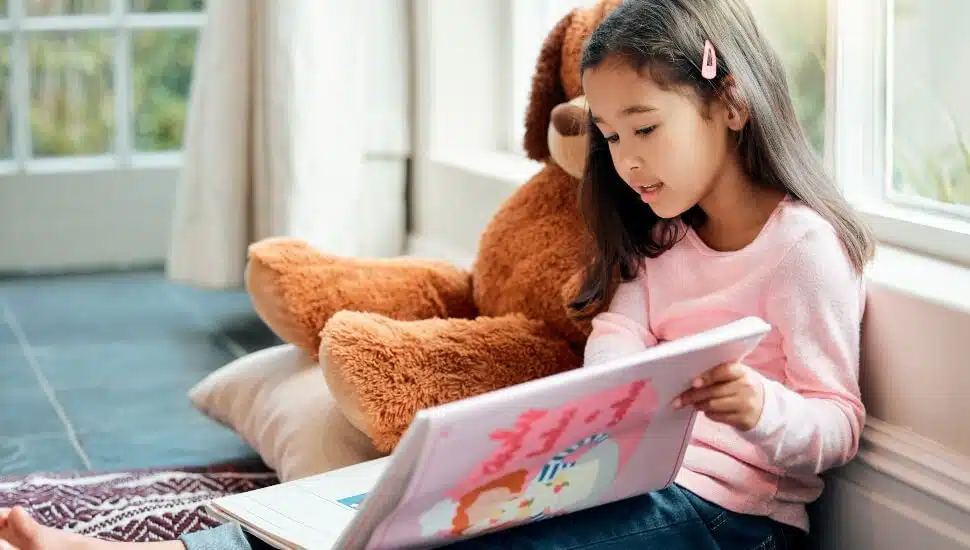 Young girl reading a book