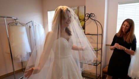 Nicole Bridal owner works with a bride.