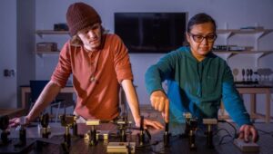 WCU physics students Chris Barns and Rumana Alam are pictured aligning a quantum cryptography experiment.