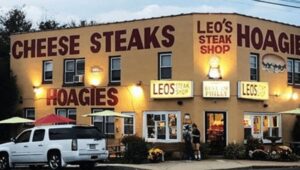 The outside of Leo's Steak Shop in Folcroft at night