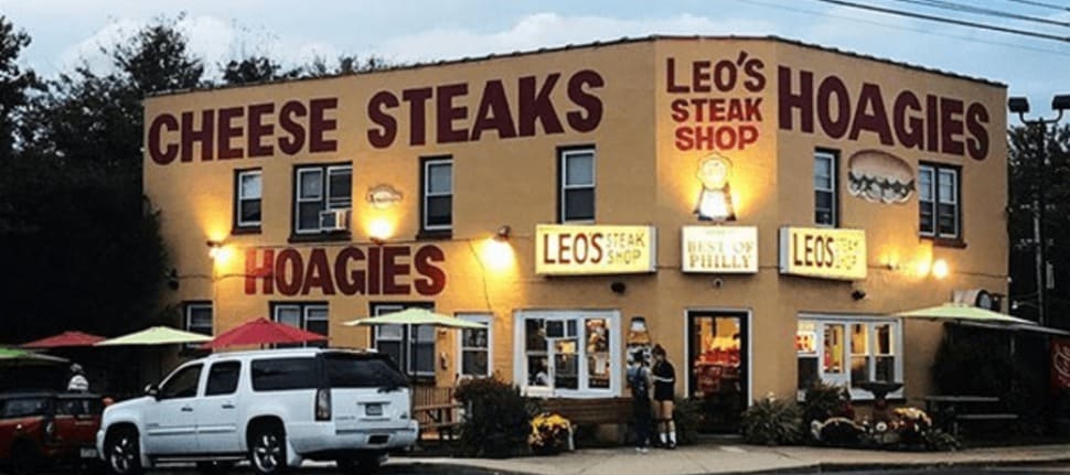 The outside of Leo's Steak Shop in Folcroft at night