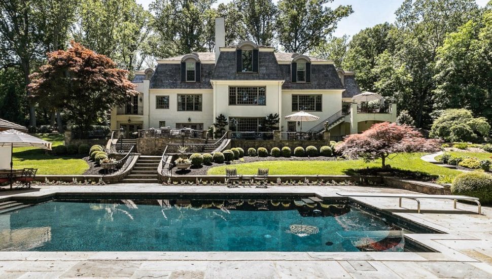 Showing the back of Mike Schmidt's former home with a pool in the foreground