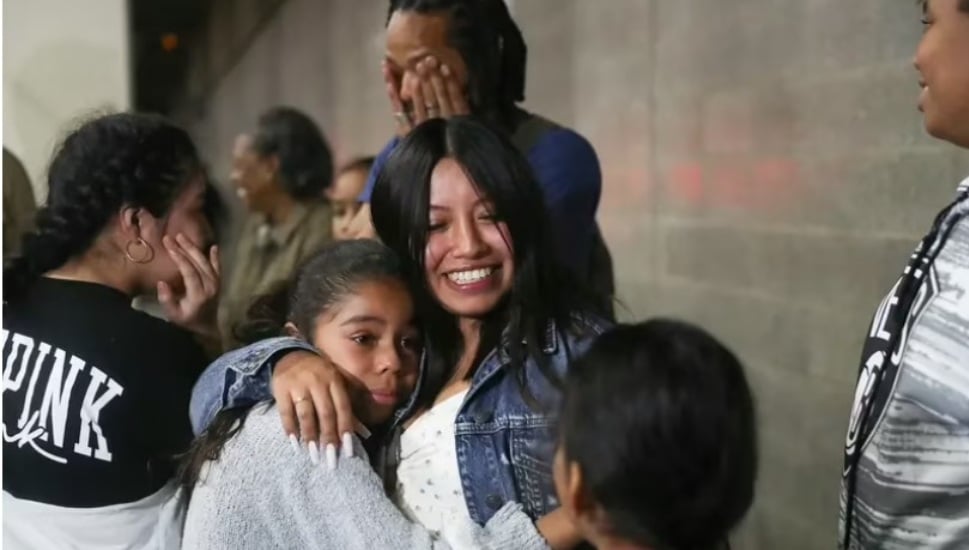 Karen Roberts, 32, hugs her daughter Jade Roberts at Philadelphia International Airport.