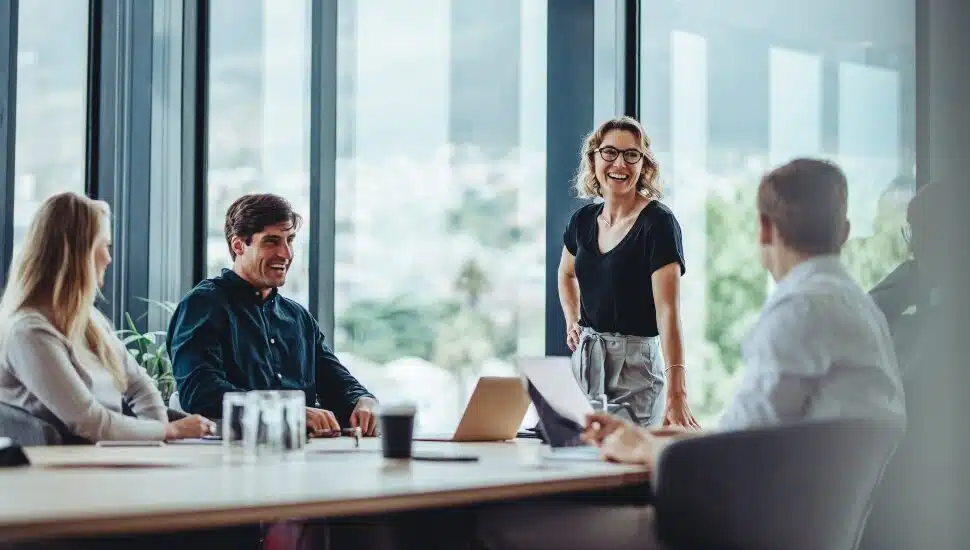 A woman executive leads a conversation in a conference room