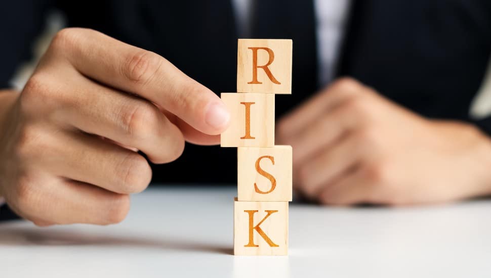 Wooden Letter blocks spelling our RISK