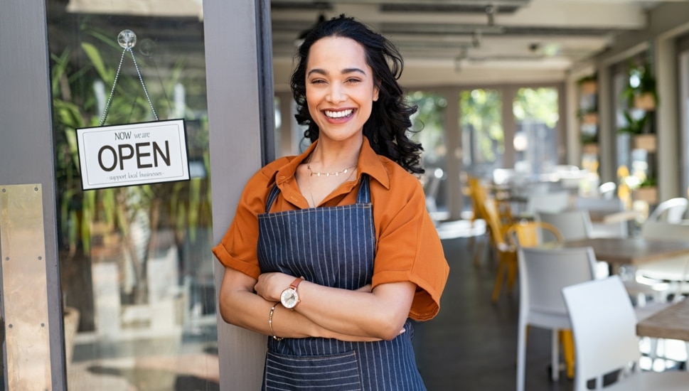 Small Business Owner in front of her store.