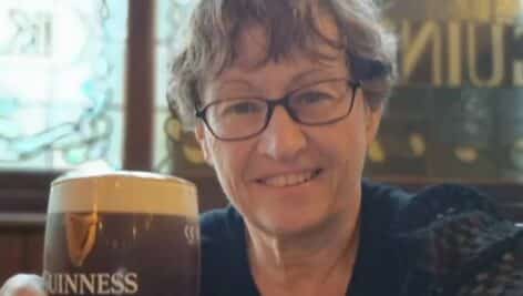 Kathleen Fry drinking a Guinness in Ireland.