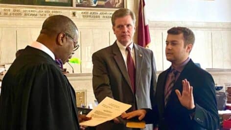 Jordan Rhone getting sworn in as assistant district attorney.