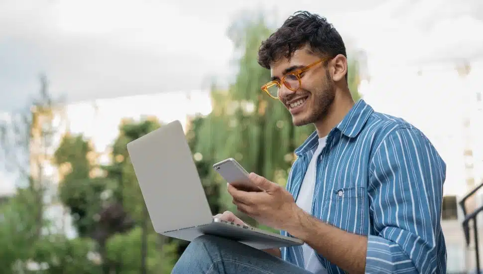 person sitting on laptop