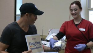 Adam Joseph giving blood for the first time.