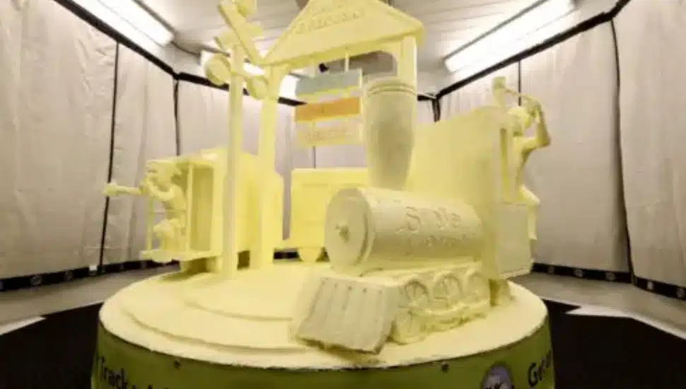 The American Dairy Association sculpture features a train being conducted by a cow and carrying kids fueling up on dairy foods.