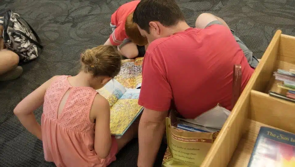 Kids reading at library.