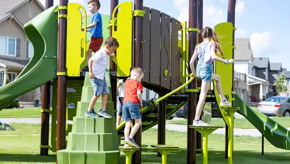 Boys and girls playing on playground equipment