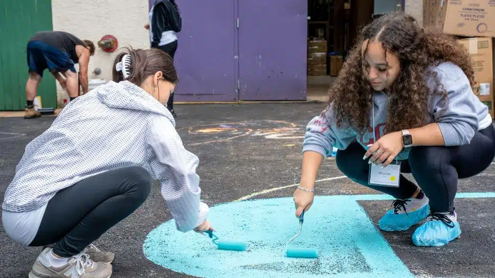 Two Neumann University first-year students do some community service work at Pathways PA