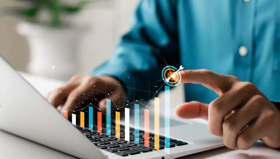 Man looking at business growth.