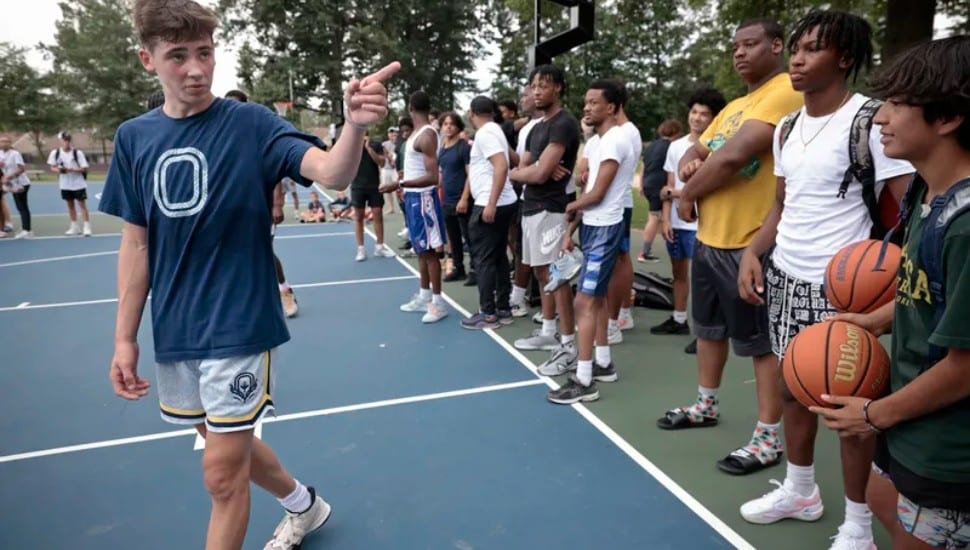 TikTok star Jake West on basketball court at park with crowd in Blue Bell, PA