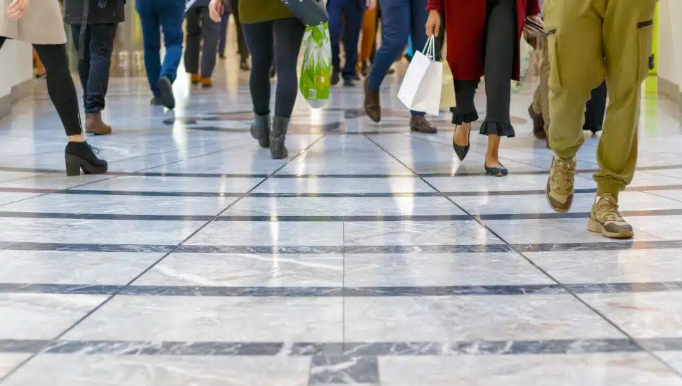 People walking in an indoor shopping mall.