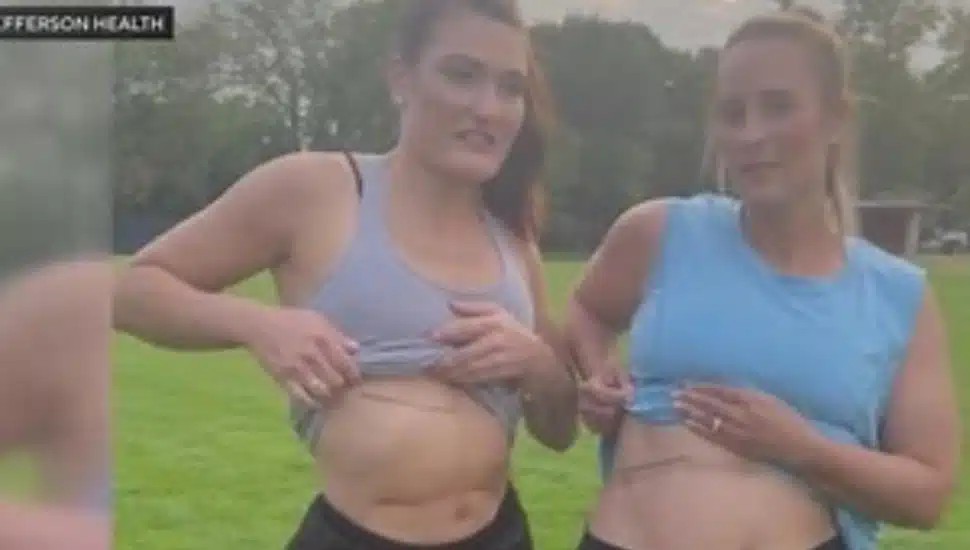 Kaitlyn Wagner and Ashley Renshaw showing their tattoos.