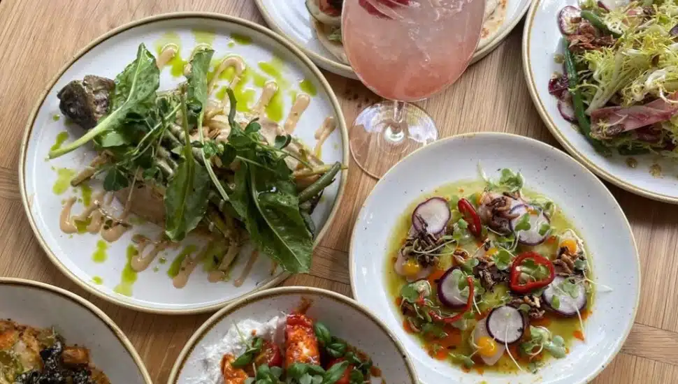 table spread of different dishes at lola's garden ardmore