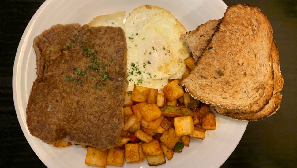 eggs, toast, scrapple, and potatoes on a plate