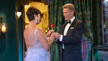 Golden Bachelor Gerry Turner hands a rose to Susan Noles of Aston