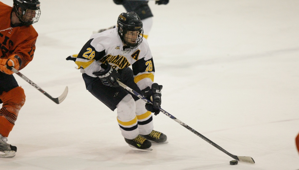 Mike Hedden in action on the ice during an ice hockey game.