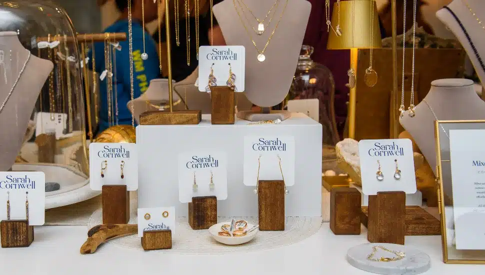 A window display of Sarah Corwell Jewelry. Sarah Cornwell jewelry