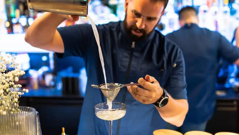 bartender pouring cocktail