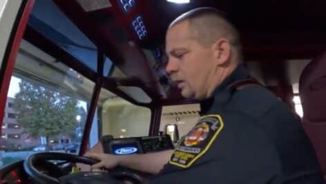 Joe Hoffman in the driver's seat of a firetruck at Abington Fire Company.