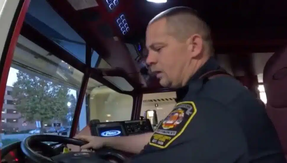 Joe Hoffman in the driver's seat of a firetruck at Abington Fire Company.